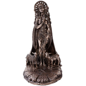 Bronze statue of a woman with two sheep on a white background