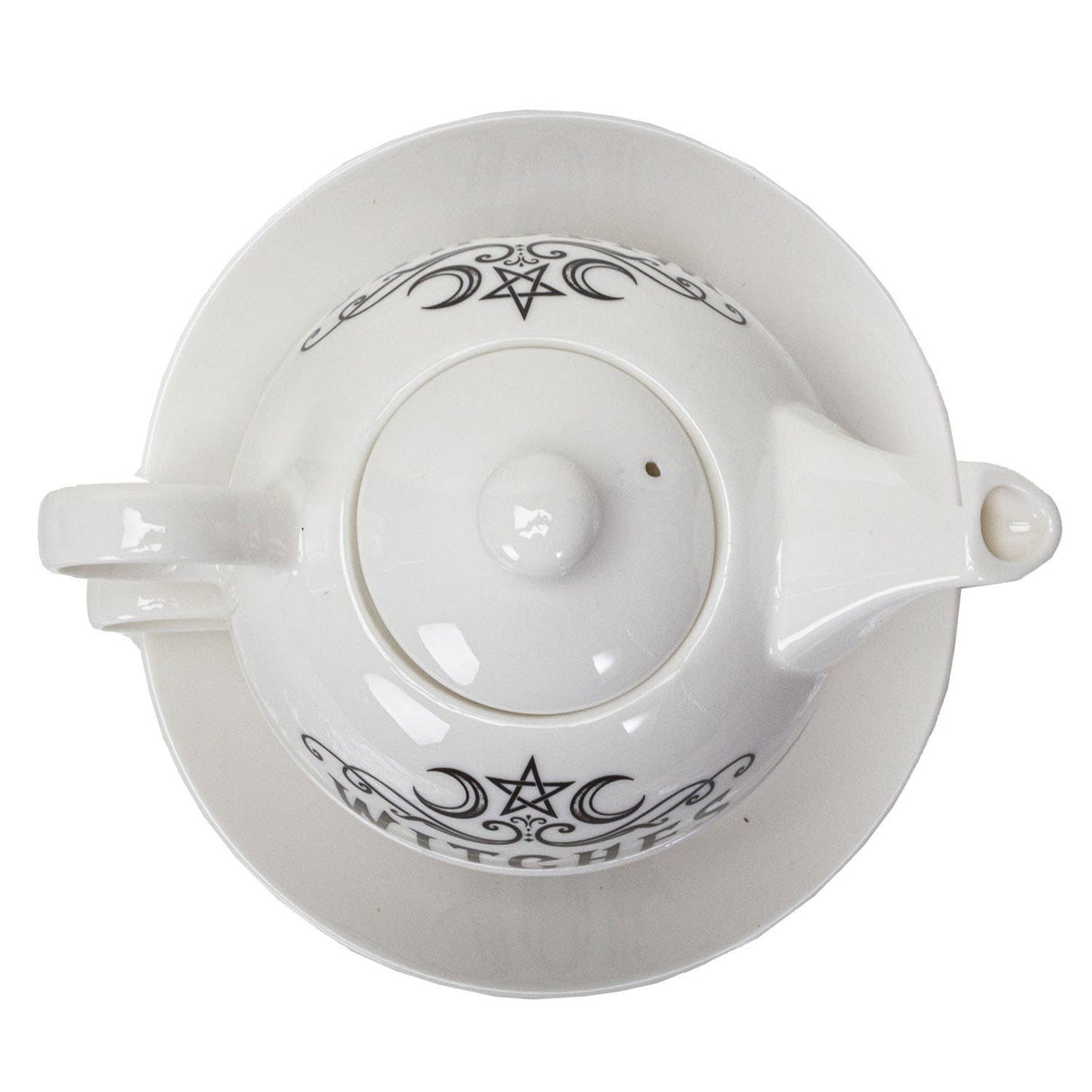 White ceramic teapot with a matching saucer, featuring black gothic-style witch illustrations and the word 'WITCH' printed on the lid.