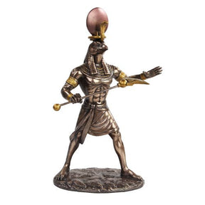 Bronze-colored warrior figurine with helmet and spear on a white background