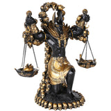 Statue of a deity with scales and skulls on a white background