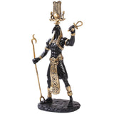 Statue of an Egyptian god with black and gold coloring on a white background