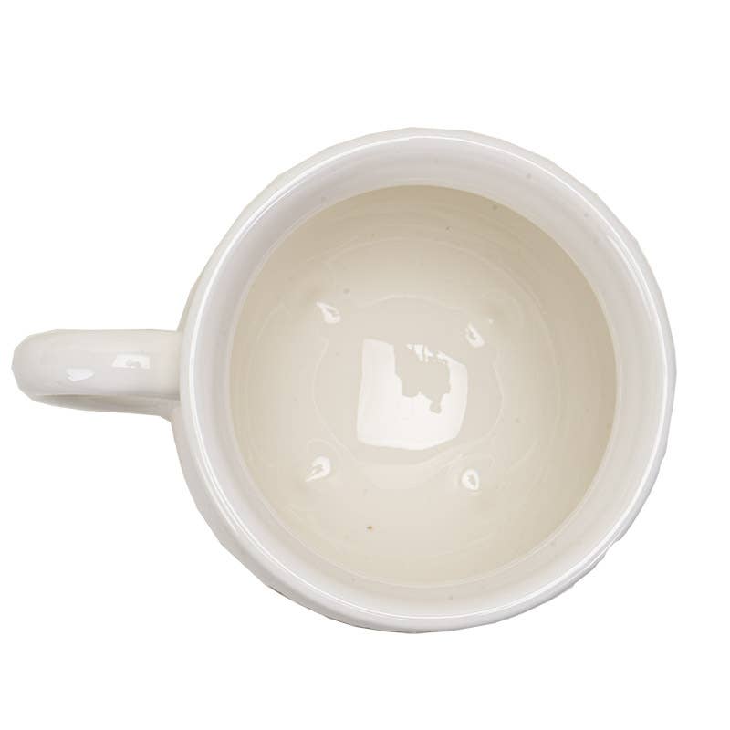 White ceramic mug with a handle on a white background