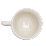 White ceramic mug with a handle on a white background