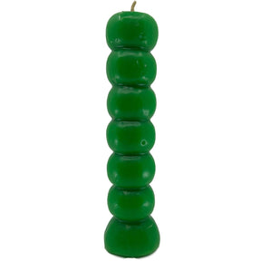 Green, ribbed candle with a flared base.