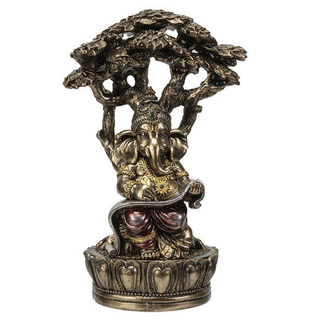 Decorative Ganesha statue seated figure with a tree-like structure on a white background
