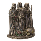 Bronze statue of three women with various items on a white background