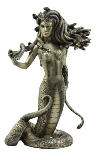 Bronze statue of a mythical creature with snake-like body and lion's head on a white background