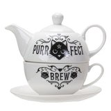 White teapot and cup set with black cat design and text on a white background