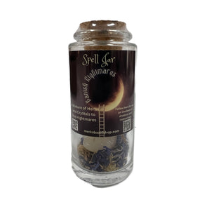 Banish Nightmares Spell Jar filled with herbs and crystals.
