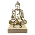 White ceramic candle holder shaped like a Buddha figure.