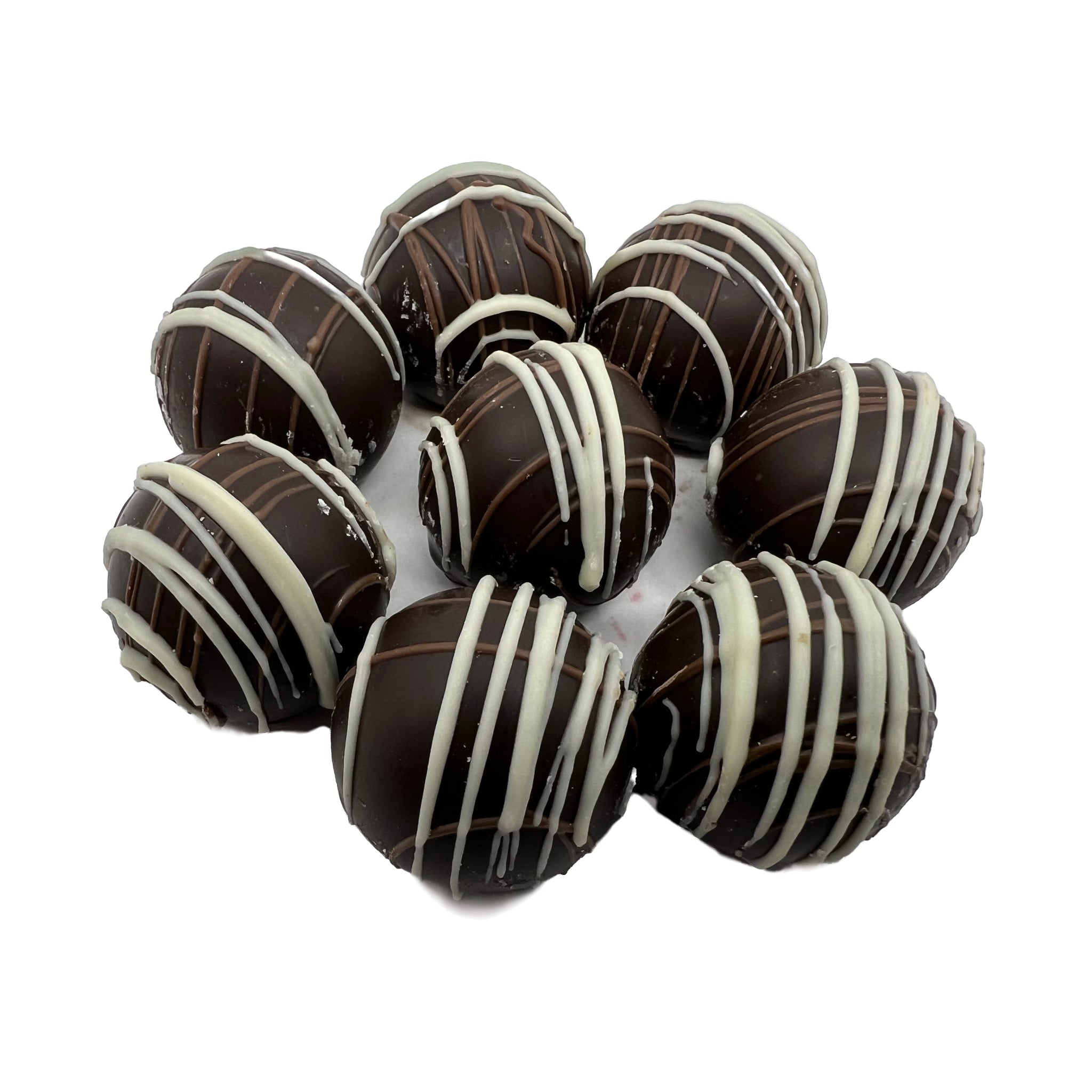 Caramel Dark Chocolate Truffle.  Dark chocolate balls with brown caramel stripes and white thicker stripe lacing crossing them. 