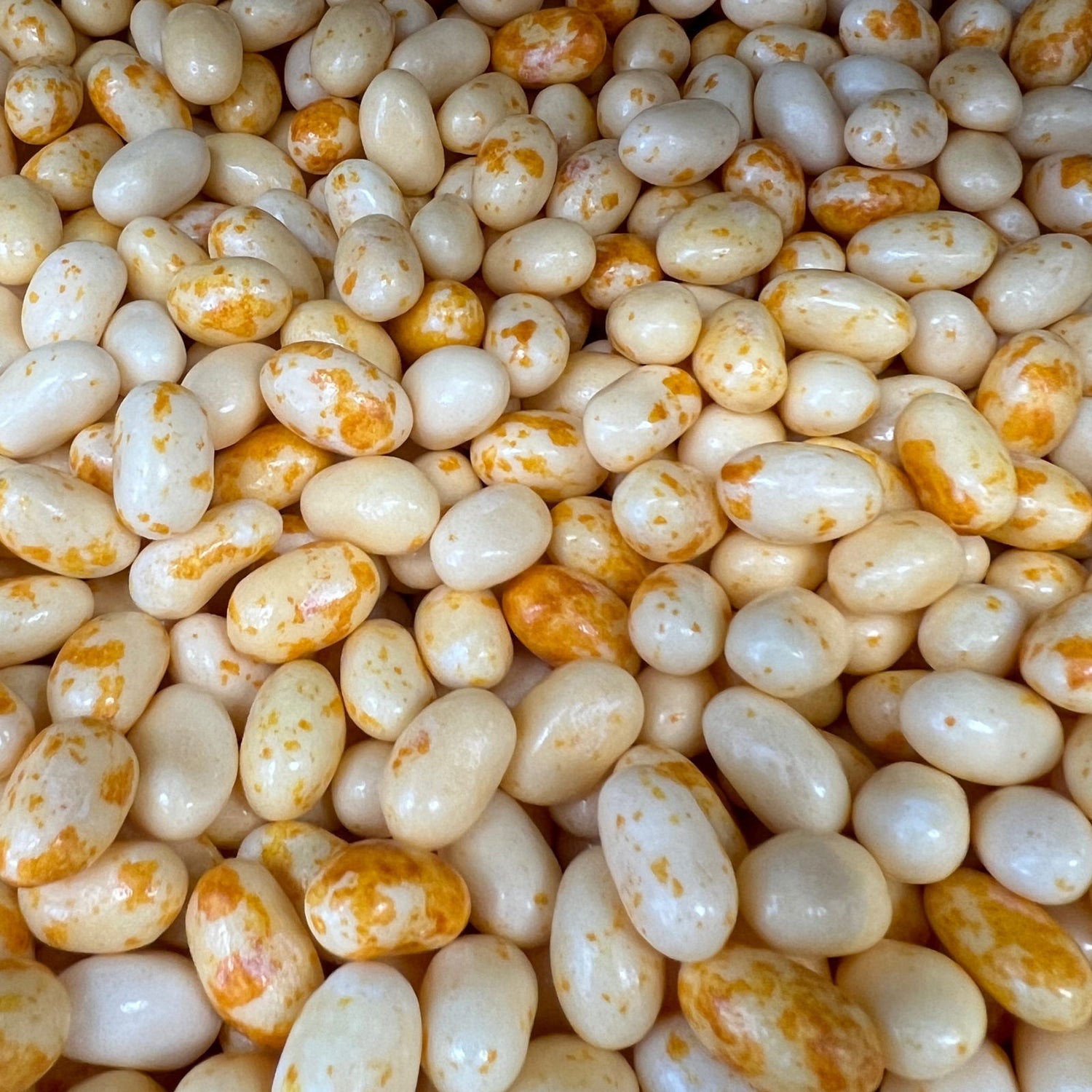 Caramel Corn Jelly Belly Beans - Small Jelly Beans whoosh white and brownish orange mottling.