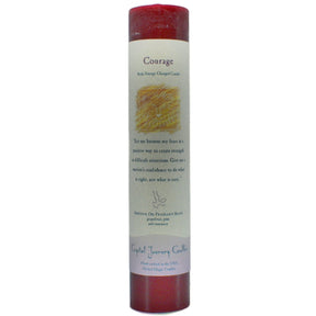 Red pillar candle with "COURAGE" label.