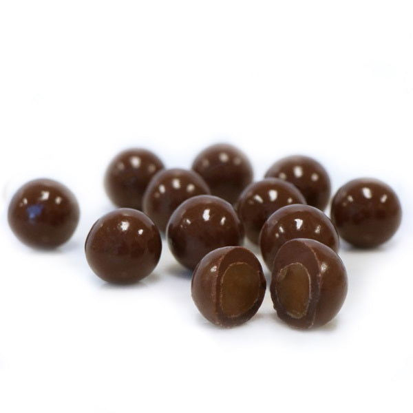 Dark Chocolate Covered Sea Salt Caramels - small dark chocolate balls one cut in half to show caramel center 