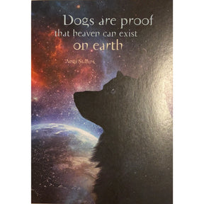 Greeting card with a silhouette of a dog looking at the Earth against a starry night sky. The quote "Dogs are proof that heaven can exist on earth" is written on the image, attributed to Angi Sulfins.