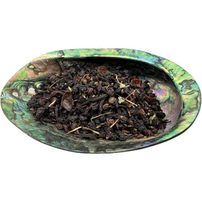 Dried Elderberry Support Tea Organic in an abalone shell.