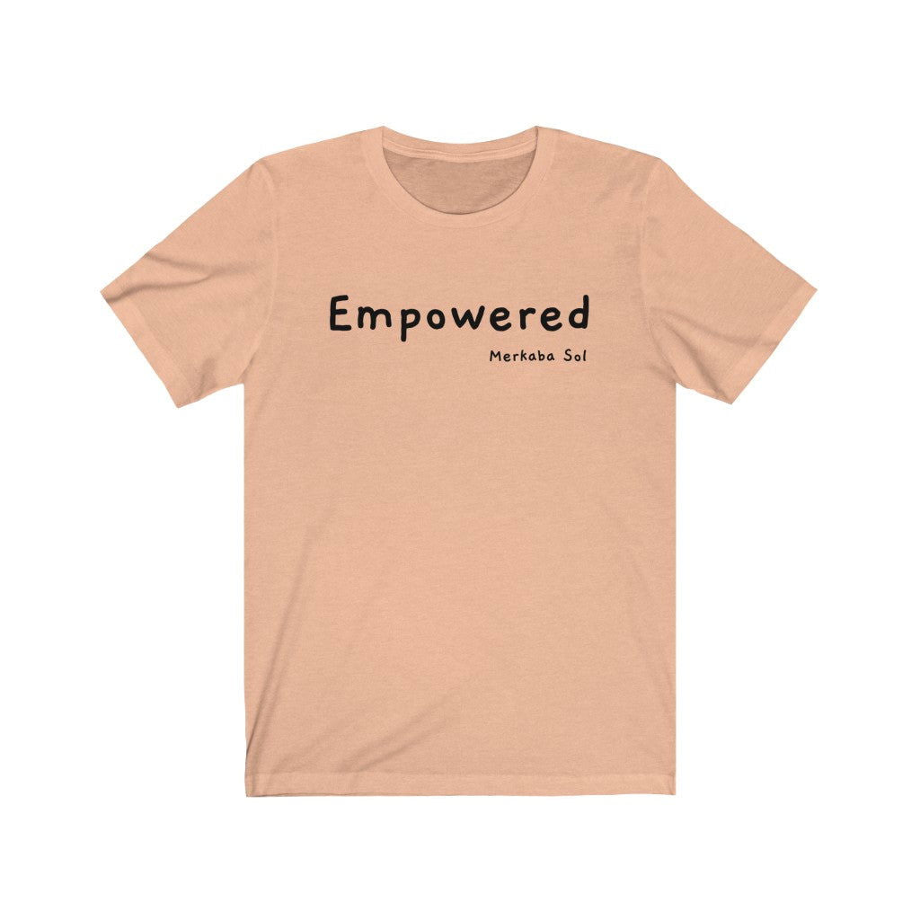 Empowered Short Sleeve Tee - Empowered. Bring inspiration and empowerment to your wardrobe with this Empowered t-shirt in peach color or give it as a fun gift. From merkabasolshop.com