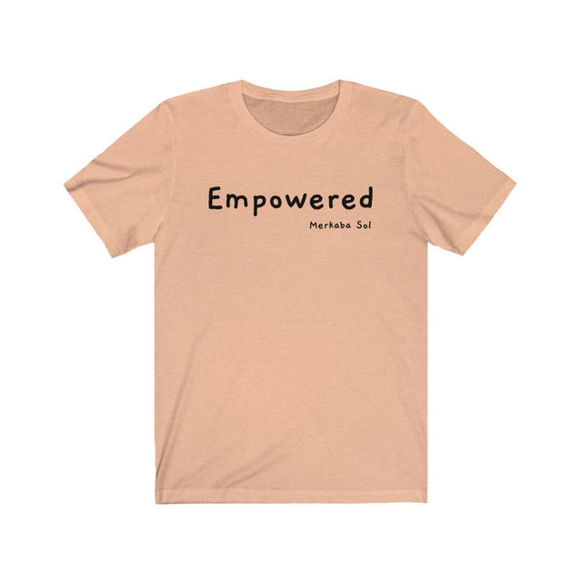 Empowered Short Sleeve Tee - Empowered. Bring inspiration and empowerment to your wardrobe with this Empowered t-shirt in peach color or give it as a fun gift. From merkabasolshop.com
