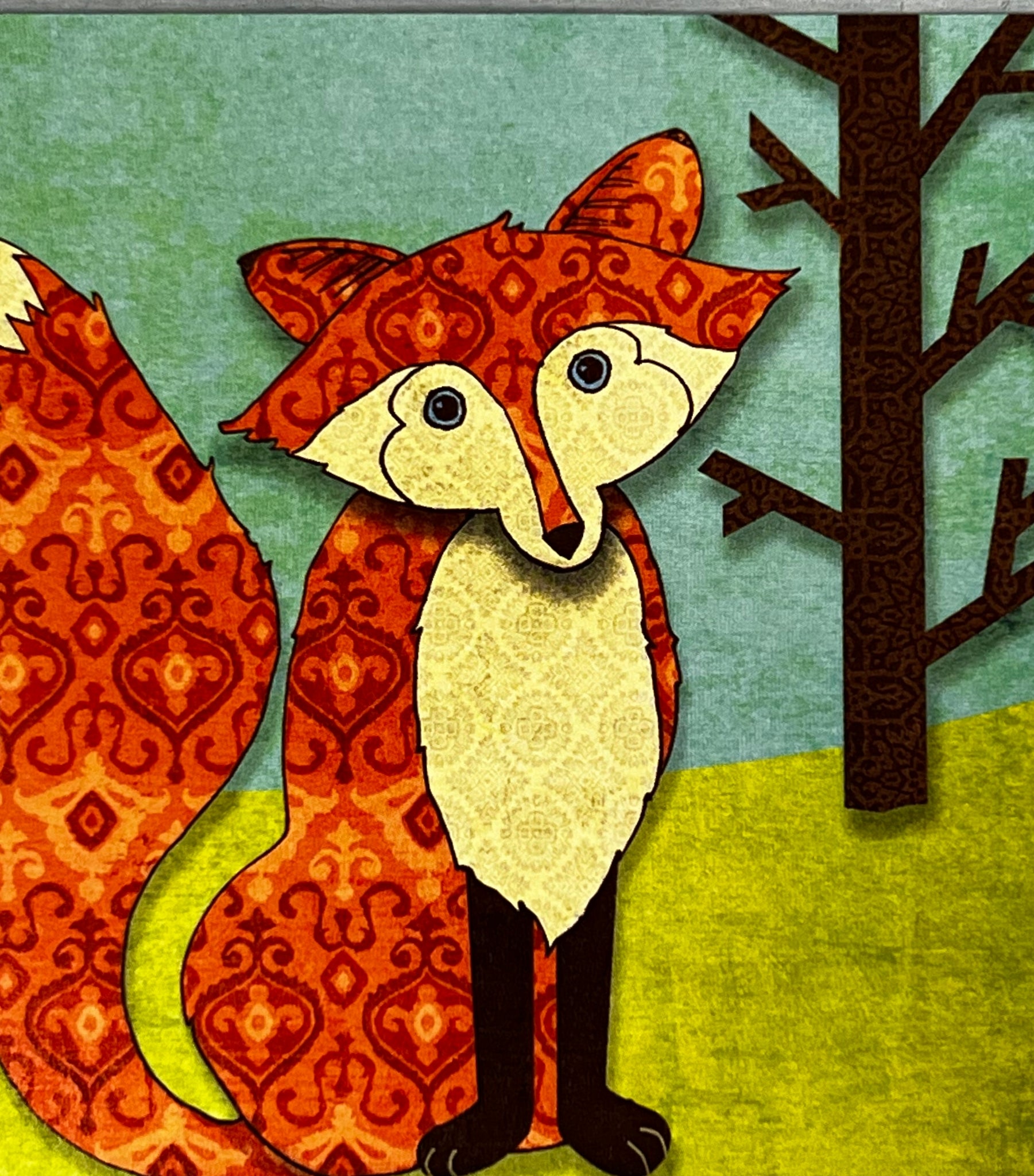 Image of cartoon fox sitting in woods 