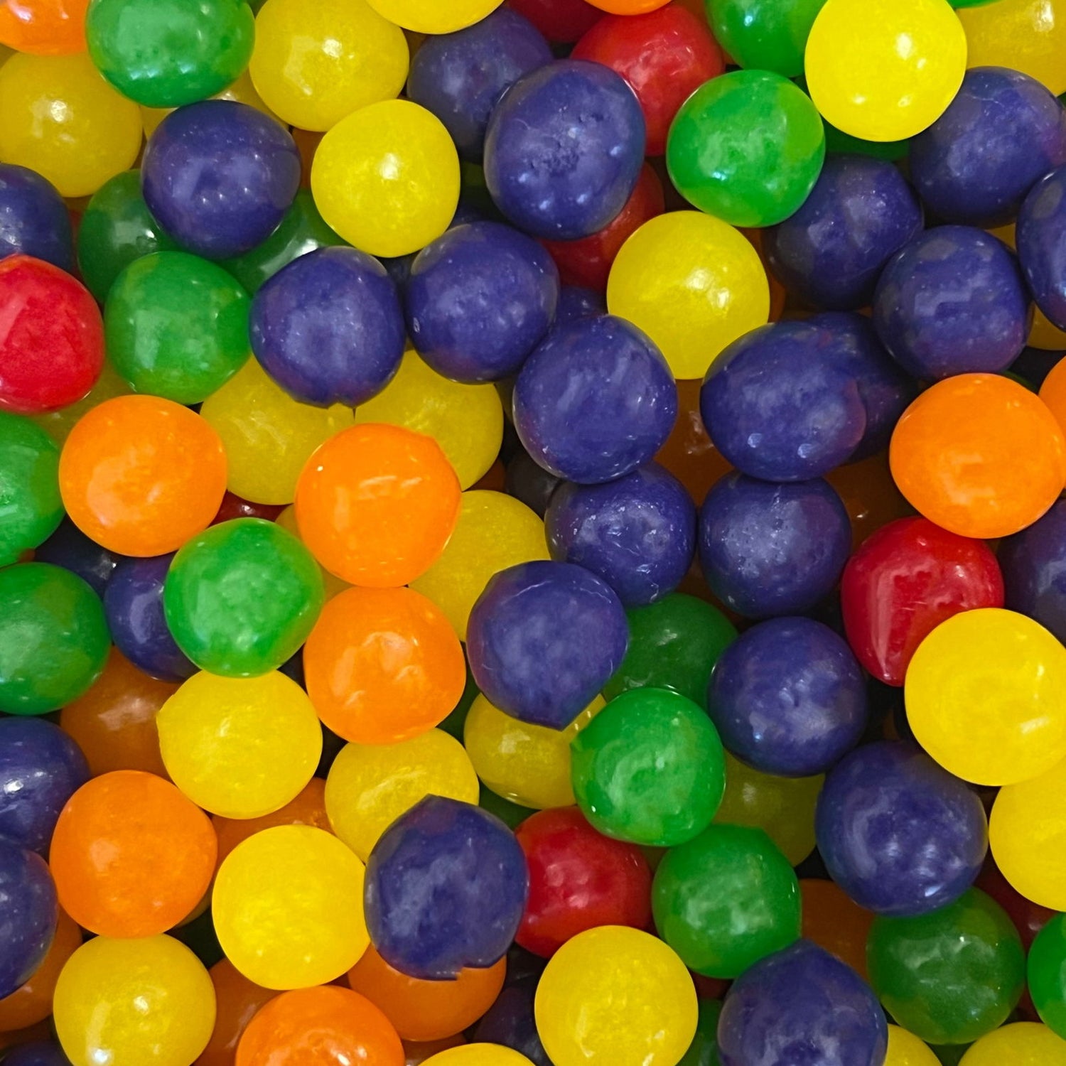 Fruit Sours - Round marble size candies in bright colors.  Fruit Sours 