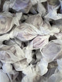 Grape Salt Water Taffy - Grape colored candy piece with white swirl center wrapped in wax paper 