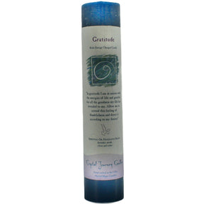 Blue candle with "GRATITUDE" label.