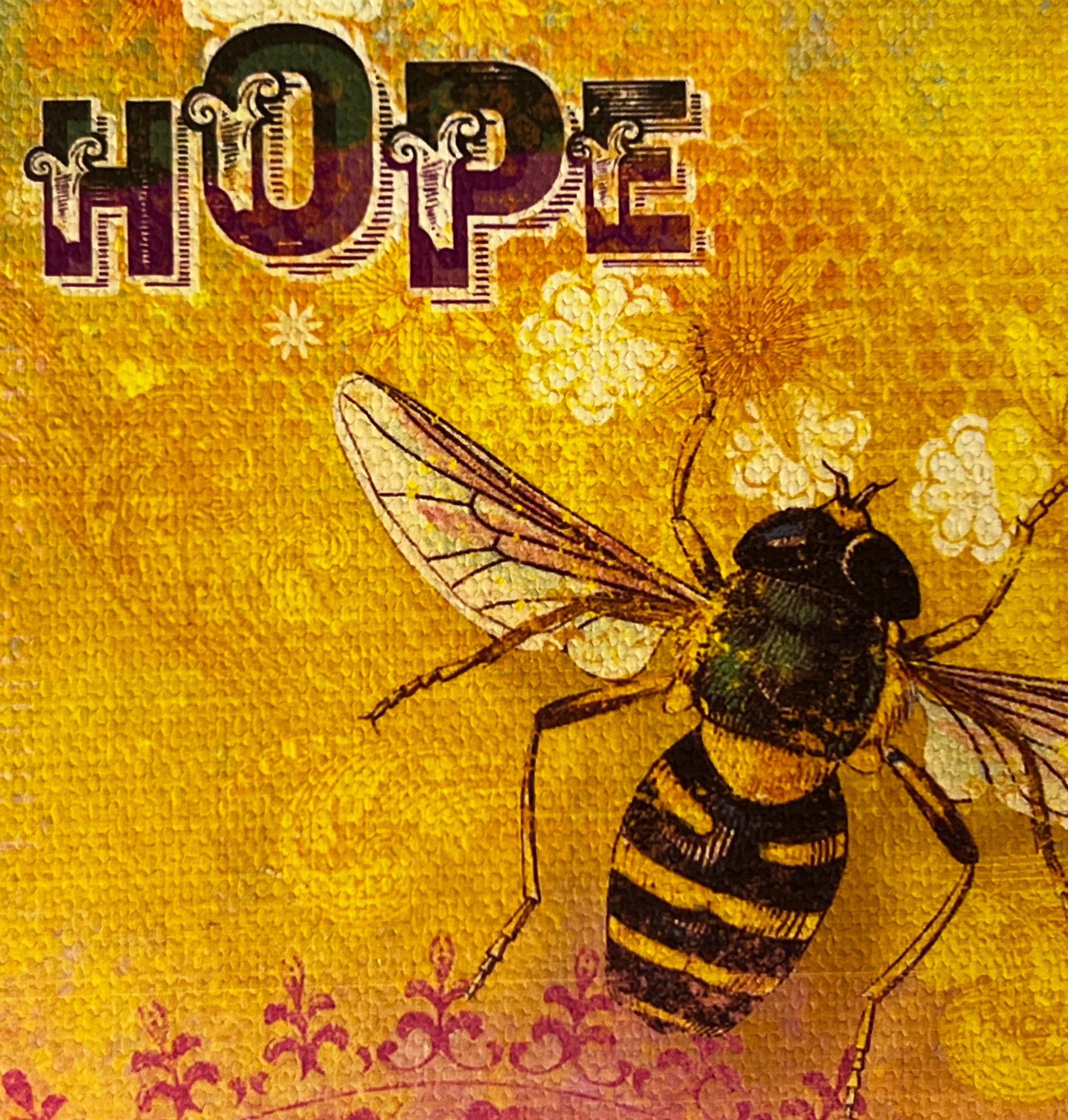 Yellow square with image of a bee and honey comb word hope on it 