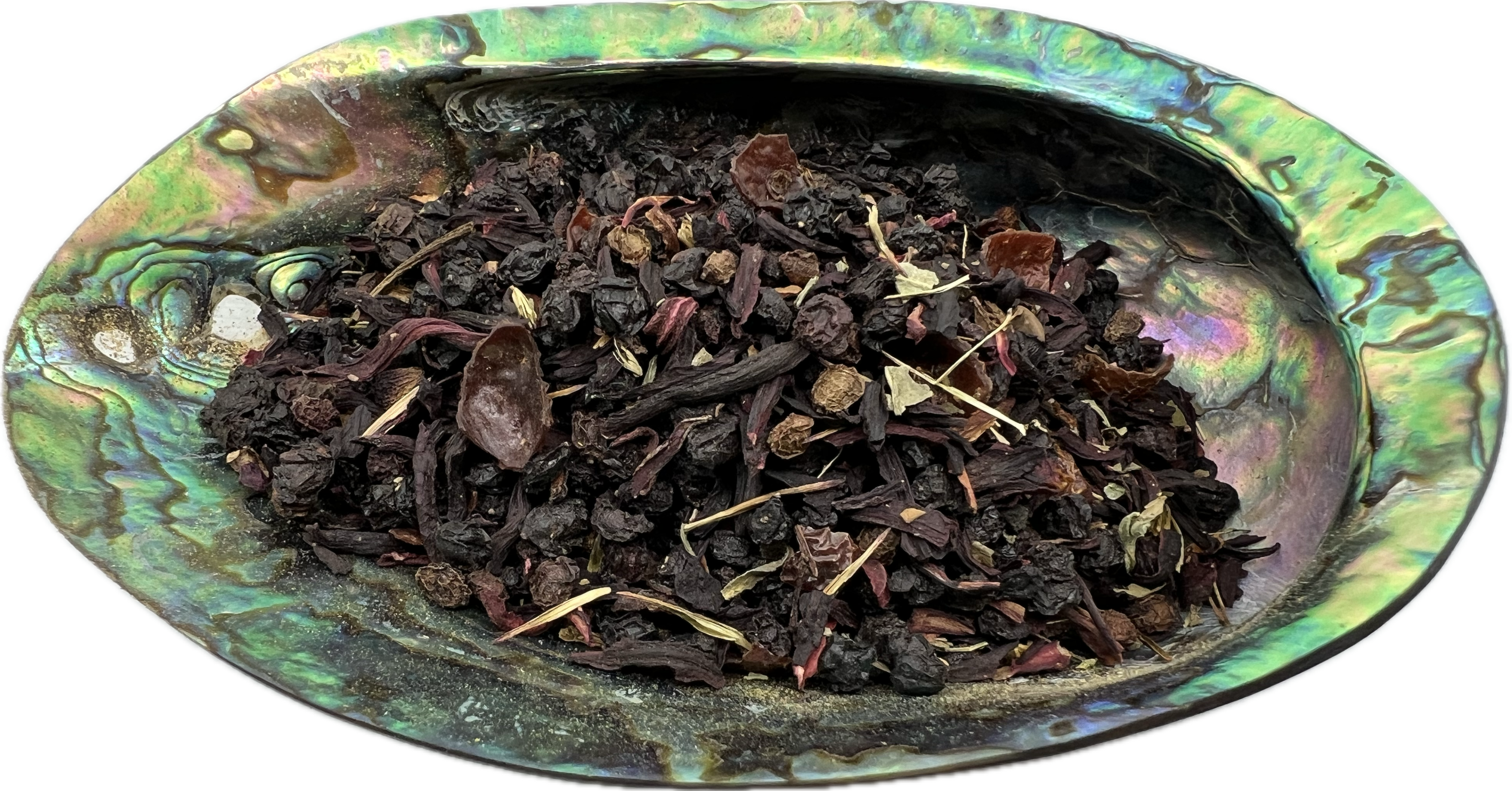 a mix of dried herbs in  a shell bowl 