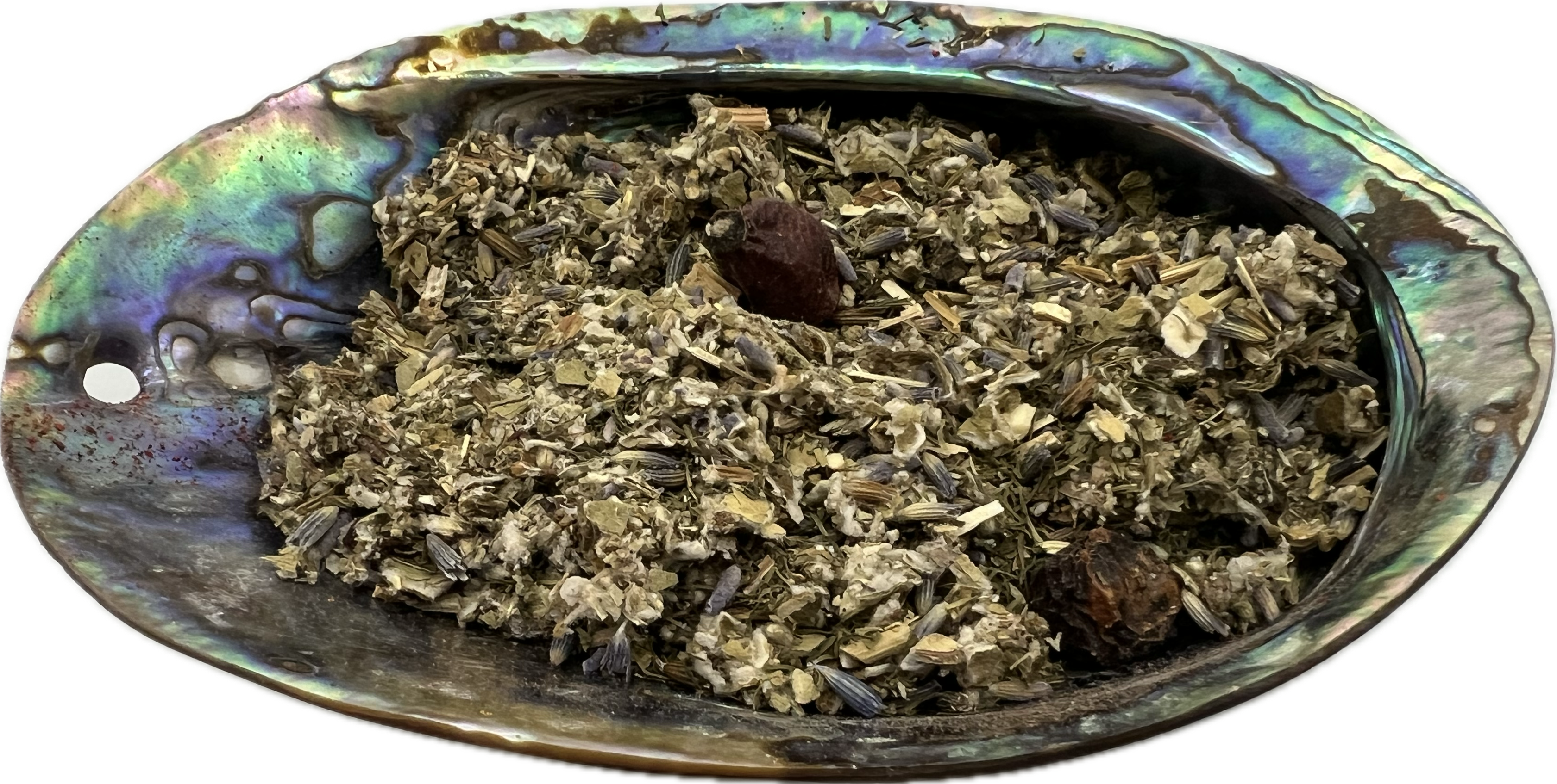 dried mix of herbs in a shell bowl 