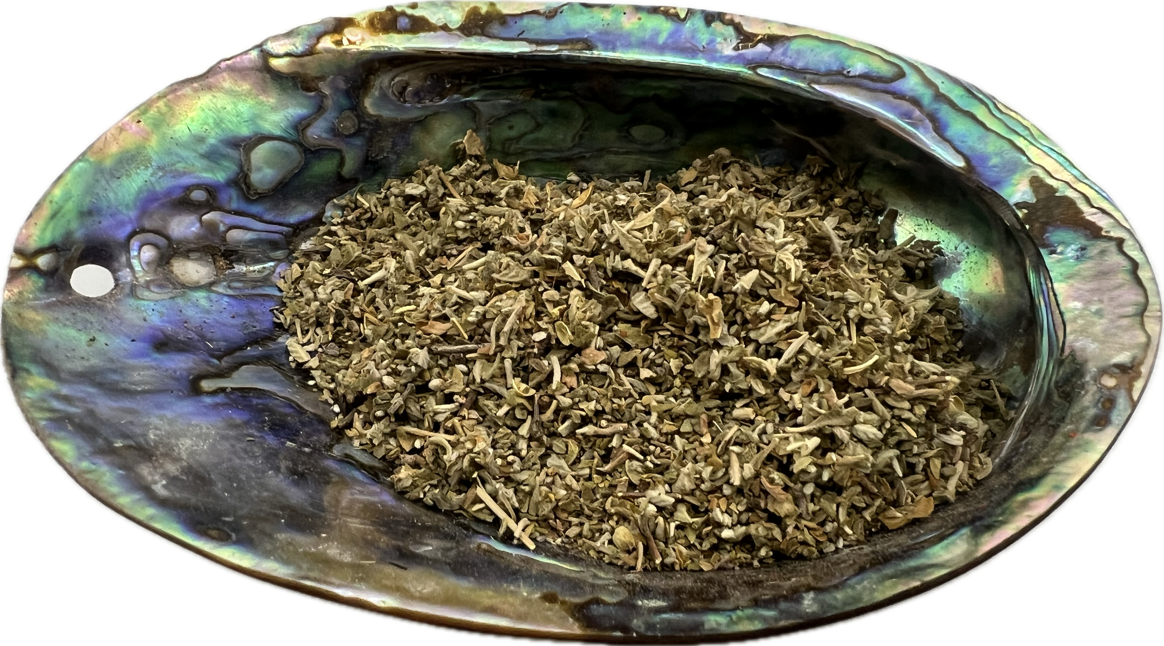 dried herb in a shell bowl 
