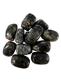 dark mottled stones with wisps of brown and white 
