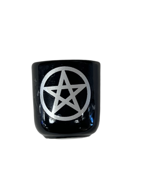 Black cube candle holder with a silver pentacle 