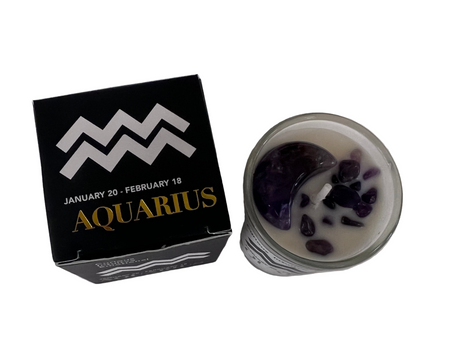 Aquarius zodiac sign candle and packaging on a white surface
