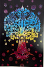 large black tapestry with colorful tree and sitting buddha