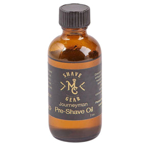 Journeyman Pre Shave Oil - Journeyman - An amber colored bottle of pre-shave oil with black label and black screw lid.
