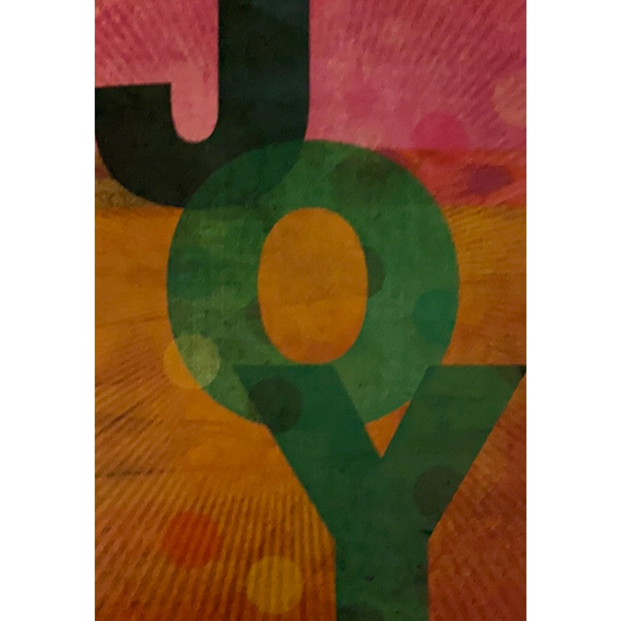 The word "JOY" in bold letters, with a colorful abstract background of pink, orange, and yellow.