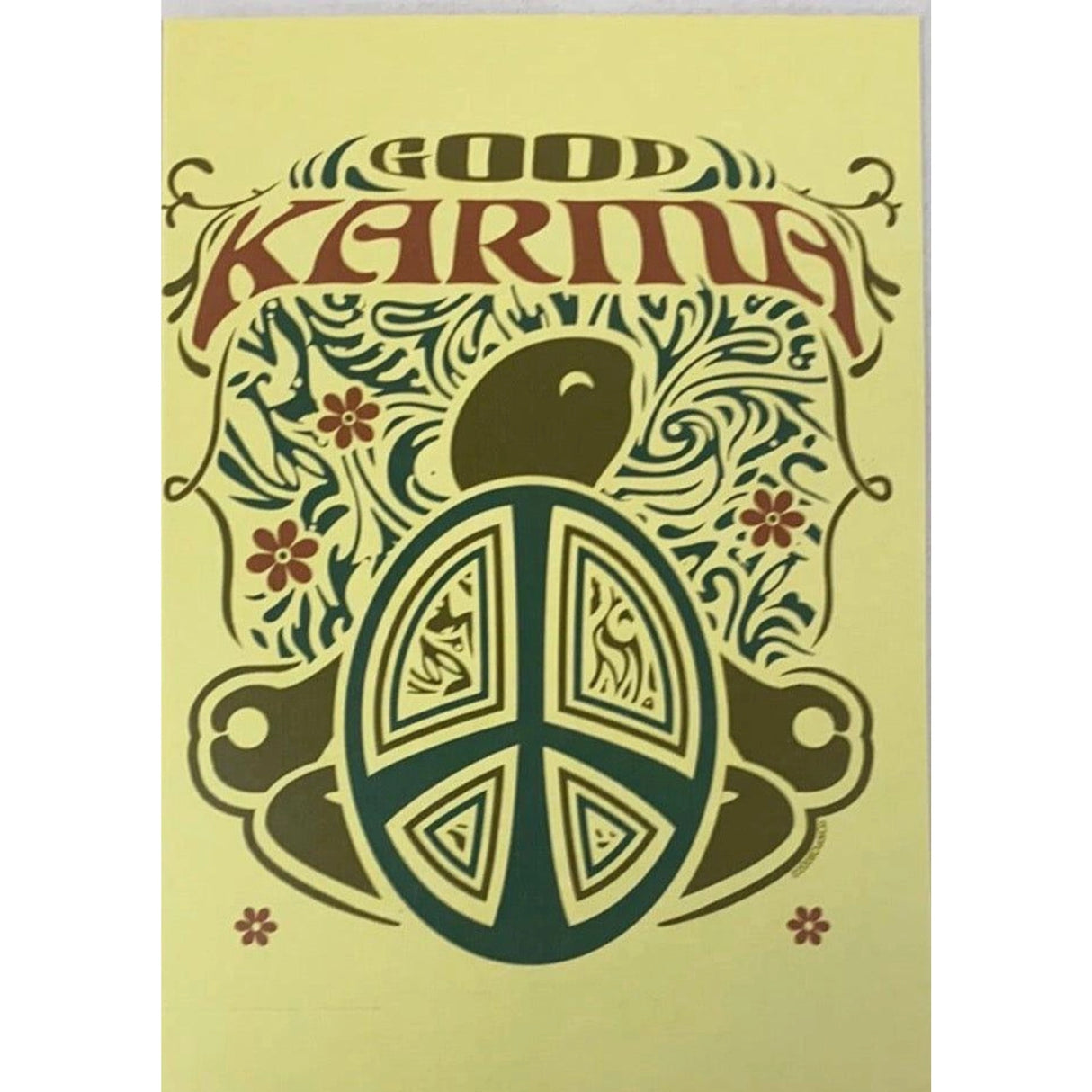 Yellow greeting card with a brown turtle and a peace sign. The word "KARMA" is written in a decorative font above the image.
