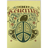 Yellow greeting card with a brown turtle and a peace sign. The word "KARMA" is written in a decorative font above the image.