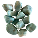 A cluster of medium-sized, tumbled Larimar stones with a smooth, polished finish and a vibrant blue color with white veining.