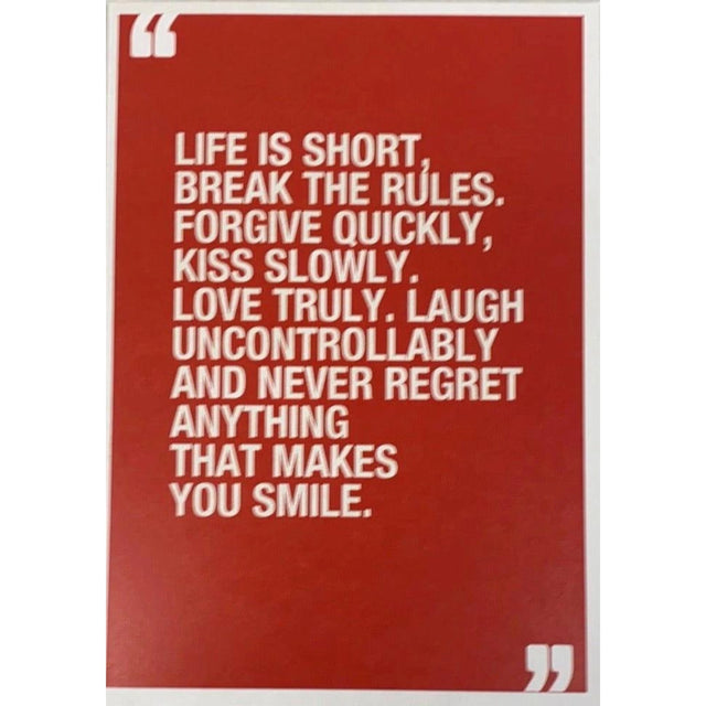 Red greeting card with a quote by Mark Twain that reads: "LIFE IS SHORT. BREAK THE RULES. FORGIVE QUICKLY, KISS SLOWLY, LOVE TRULY, LAUGH UNCONTROLLABLY AND NEVER REGRET ANYTHING THAT MAKES YOU SMILE."