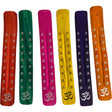 Assorted colored wooden incense sticks with OM symbol.