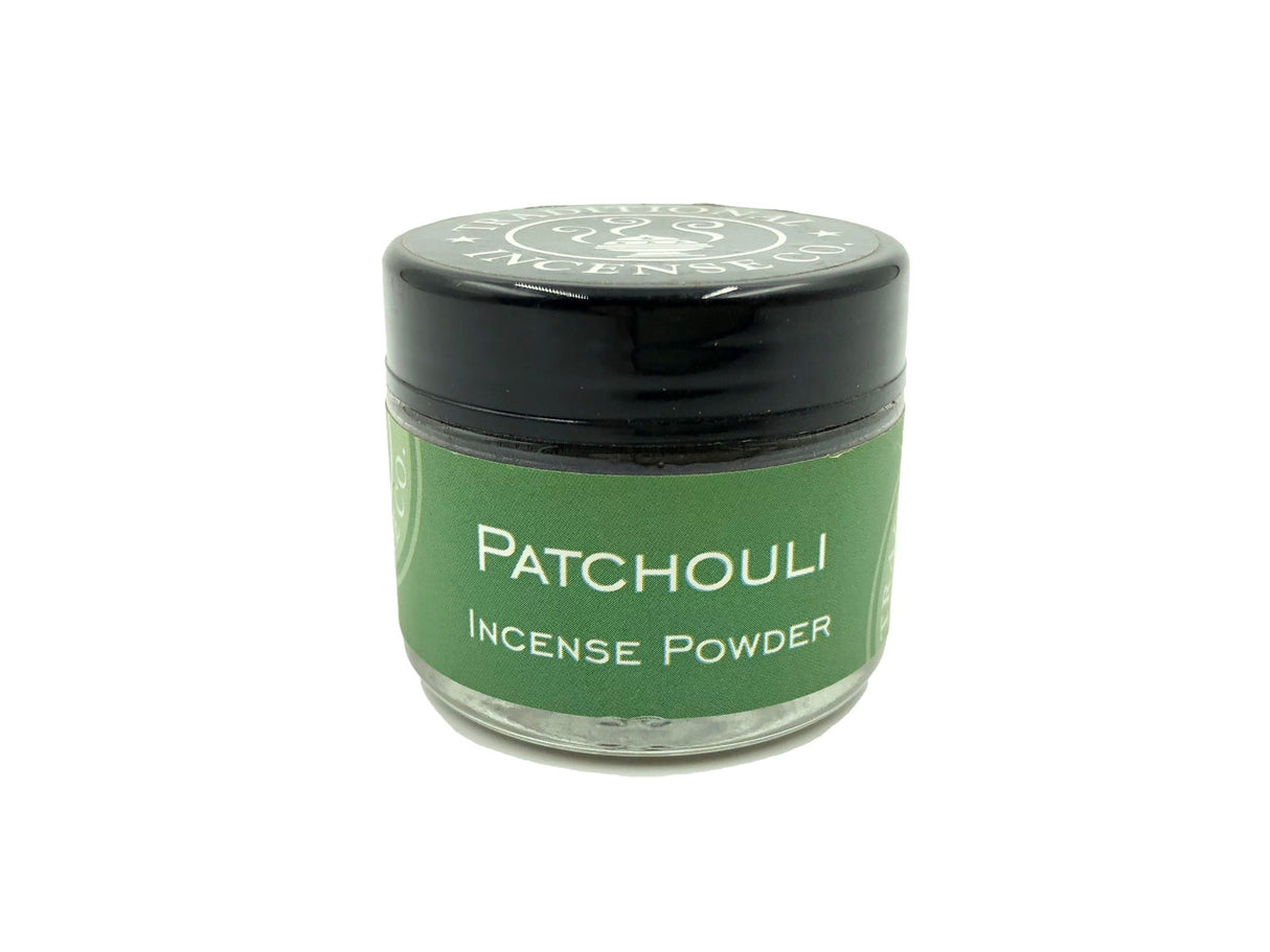 Patchouli Incense Powder - Small round, glass container holding patchouli incense powder 