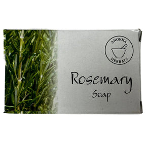 White soap box with a green border and a picture of rosemary leaves. The label reads "Anokha Herbals" and "Rosemary Soap."