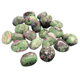 Ruby Zoisite Tumbled - Polished stones with green and pink hues and black flecks.