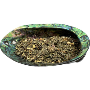 Dried Serendipitea Tea Organic in an abalone shell.