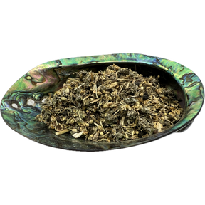 Sniffle Tea Organic - Dried mixed herbs named Sniffle Tea placed on a colorful shell bowl