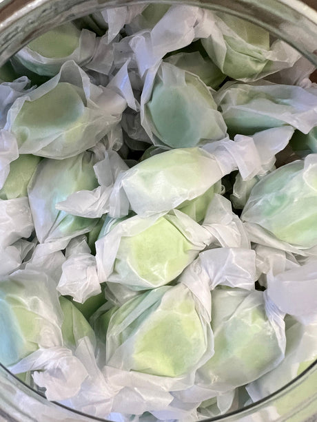 Spearmint Salt Water Taffy - Light green candy wrapped in wax paper 