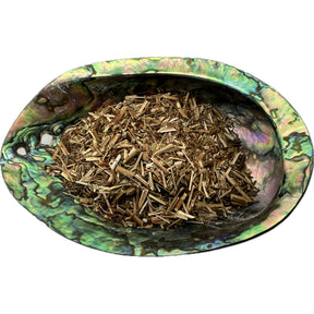 Dried St John's Wort in an abalone shell.