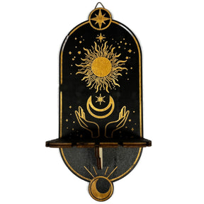 Black wooden shelf with a gold sun and moon design. The shelf has a hanging chain for a pendulum.