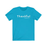 Thankful Short Sleeve Tee - Embrace being thankful. Bring inspiration and empowerment to your wardrobe with this Thankful t-shirt in turquoise color or give it as a fun gift. From merkabasolshop.com